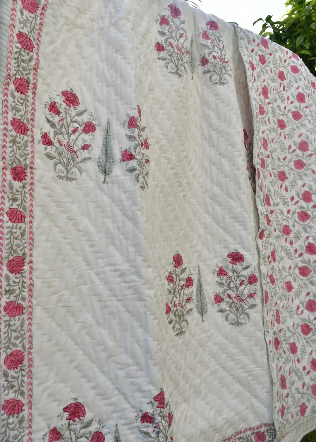 Pink and white quilt 